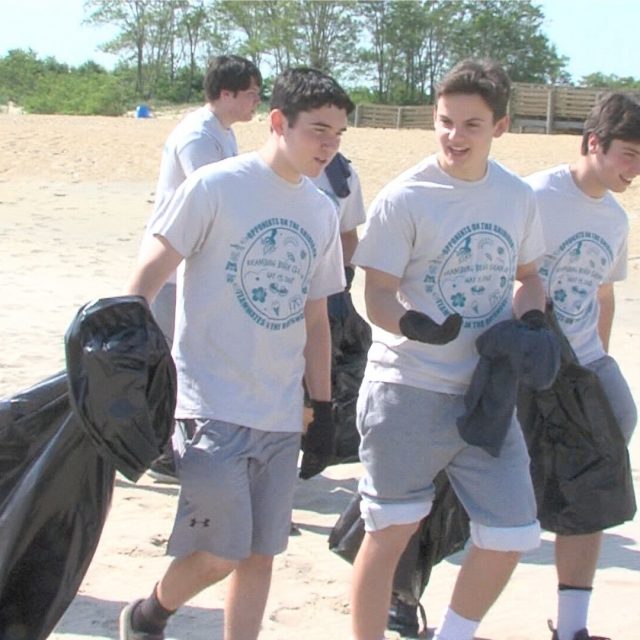 Opponents on the gridiron team up to clean Keansburg beach